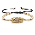 Pulsera de cuentas doradas con bola de cristales y dije de corona en cordón trenzado - Dorado