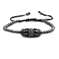 Pulsera trenzada con doble corona de cobre y microcircón con cuentas de hematita negra - Negro de Humo