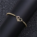 Golden 4mm bead elastic bracelet with a colorful zircon heart and baby foot charm - B0026 Gold
