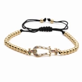 Bracciale a sfere dorate con fibbia a ferro di cavallo in zirconi colorati e cordino nero - Oro