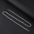 Detail of 5mm stainless steel wheat chain necklace with gold accents on black leather - Necklace 55CM / Silver and Gold