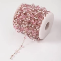 Detail view of DIY handmade chain with pink resin stones and white pearls on spool - 25# Rose Pink