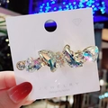 Sparkling crystal butterfly hair clip with gold base on jewelry display card - White