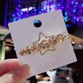 Barrette étoile en cristal ambré avec strass et fond lumineux élégant à effet bokeh - Champagne