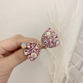 Élastique à cheveux avec nœud en strass roses étincelants et détail doré central - Rose