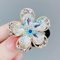 Elastico per capelli a fiore con petali di cristallo cangiante e pietra blu oro - Bianco