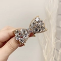 Elegante elastico per capelli con fiocco dorato e strass per acconciature raffinate - Bianco