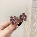 Elegant gold bow hair tie with sparkling purple crystals and black elastic band - Purple