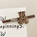Brown braided leather teddy bear hair clip with rhinestones and me letter detail - Coffee