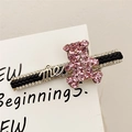 Pink rhinestone bear hair clip with golden metal letters on elegant black woven base - Pink