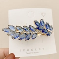 Eleganter goldener Haarclip mit blauen Kristallen und schimmernden Strasssteinen - Blau