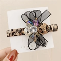 Leopard print duckbill clip with black organza bow and LOVE pearl rhinestone cluster - Leopard Print