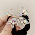 Elastico per capelli a farfalla con cristalli scintillanti, strass colorati e velluto nero - Bianco