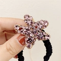 Élastique à cheveux étoile de mer en strass violets avec base dorée et bande noire - Violet