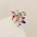 Mini hair claw clip featuring colorful crystal flowers on a golden alloy finish - Multicolor - Small