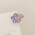 Mini molletta per capelli a fiore dorato con cristalli viola su carta bianca - Viola