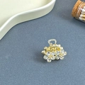 Mini gold hair claw clip with sparkling crystal flower clusters on a dark grey surface - Double Flower White - Small