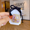 Vintage black hair tie with pearl, purple zircon stones, and small golden bee detail - Square Purple