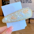 Barrette style bohème avec coquillages, perles et bordure de strass dorés brillants - Goutte Blanc Cassé