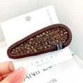Amber rhinestone BB clip with brown woven edge and Handmade label on display card - Teardrop / Brown