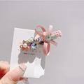 Detailed close-up of a pink ribbon bow hair clip with crystal and pearl embellishments - Pink
