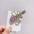 Detail showing handcrafted pink crystal flower hair clip with sparkling rhinestones - Pink