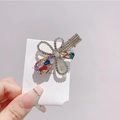 Detailed close-up of a floral hair clip featuring colorful rhinestones and alloy base - Colorful