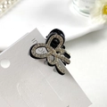 Elegante molletta per capelli a fiocco nero con strass luccicanti e struttura a molla - Farfalla Piccola Base Nera Strass Bianco