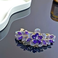 Eleganter violetter Blumen-Haarclip mit Goldlegierung und funkelnden Strasssteinen - Lila Blumen Federclip