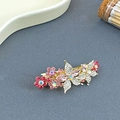 Pince à cheveux papillon dorée avec des strass étincelants roses et blancs - Rose
