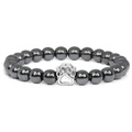 Macro shot of 10mm hematite beads bracelet with a silver dog paw print metal charm - Hematite
