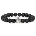 Close-up of 10mm black lava stone beads and a silver paw print charm on elastic bracelet - Volcano