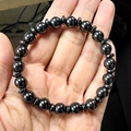 Men's fashion bracelet featuring irregular hematite beads and polished black rounds - Round Hematite Beads with Spacer