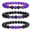 Macro shot of three beaded bracelets with purple agate, black matte, and lava rock beads - Amethyst Style