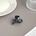 Eleganter Mini-Haarclip in Schwarz mit dunkelblauen Strasssteinen in Schleifenform - Gedrehter Stil Schwarz Basis Mit Blauem Strass