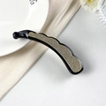 Detail of banana hair clip featuring sparkling rhinestones and elegant gold-tone edges - Crescent Banana Clip (DH01249) / Black With White Rhinestone