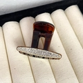 Detailed macro view of amber hair claw clip with triple row sparkling rhinestone inlay - Style Three Coffee Base White Rhinestone