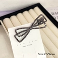 Elegant bow hair clip with black rhinestones on a stylish alloy base for women - Bow