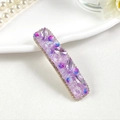 Close-up of a rectangle hair clip with purple crystal beads and floral embellishments - Style 1 / Purple