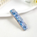 Macro detail of blue crystal rectangle hair clip with rhinestones on gold base - Style 1 / Blue