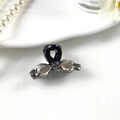 Detail of elegant black hair claw clip with rhinestones on a white ceramic tray - Style 2 Black