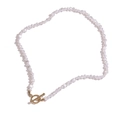 Elegant baroque irregular pearl necklace with a stylish golden OT toggle clasp on white background - Necklace (24839)