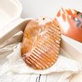 Close-up of elegant orange marble acetate comb with golden hole detail in a gift box - Coffee Marble Pattern