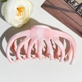 Macro detail of marble textured pink and white silicone hair claw clip showing long teeth - 10.5cm Watermelon Shape / Pink Two-Tone