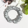 Macro detail of glossy silver-grey satin scrunchie with a matching square buckle - Silk Pleated Small Scrunchie - Smoke Gray