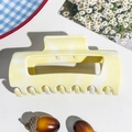 Macro shot of rectangular marble hair claw clip with warm yellow and white textures - 10.5cm Arc Square - Custard Yellow (89550)