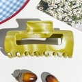 Close-up of marble pattern acetate hair claw clip with large rectangular hollow design - 10.5cm Arc Square - Mustard Yellow (89821)