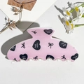 Detail shot of pink square claw clip featuring black heart prints and Nice day text - UV Printed Square Head-Cream White 167-2