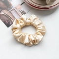Close-up of champagne satin scrunchie with soft pleated texture and silky gloss finish - Silk Pleated Large Scrunchie - Beige