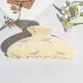 Detail of a large cream hair claw clip with pink bows and white rounded teeth - UV Printed Square Head-Cream White 167-6